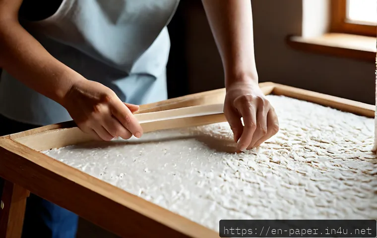 종이화지 만들기 - Photorealistic close-up of an adult craft maker creating handmade art paper, lifting a wooden deckle...